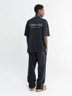 Fear of God Essentials Relaxed Fleece Piping Sweatpant Jet Black/Cloud White